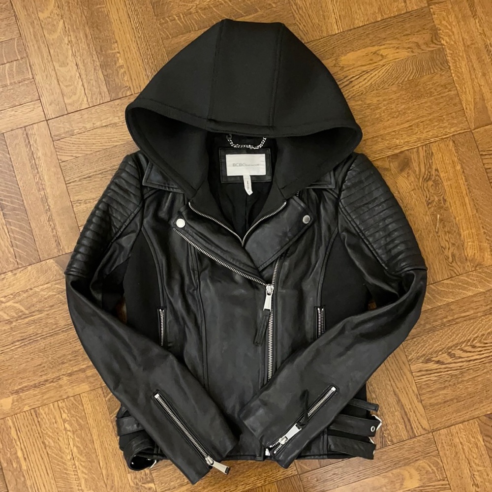 BCBG barely worn black leather moto jacket with detachable hood.